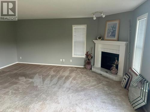 211 2Nd Street, Vernon, BC - Indoor Photo Showing Living Room With Fireplace