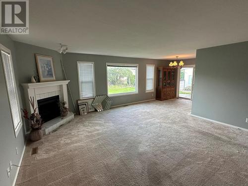 211 2Nd Street, Vernon, BC - Indoor Photo Showing Living Room With Fireplace