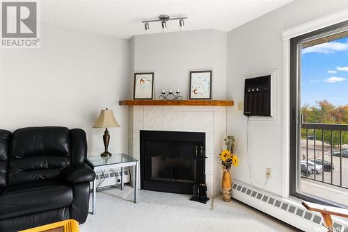 302 3420 Park Street, Regina, SK - Indoor Photo Showing Living Room With Fireplace