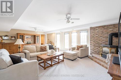 1331 Flos Road 3 E, Springwater, ON - Indoor Photo Showing Living Room With Fireplace