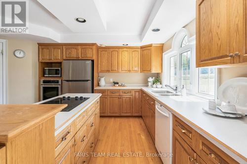 1331 Flos Road 3 E, Springwater, ON - Indoor Photo Showing Kitchen With Double Sink