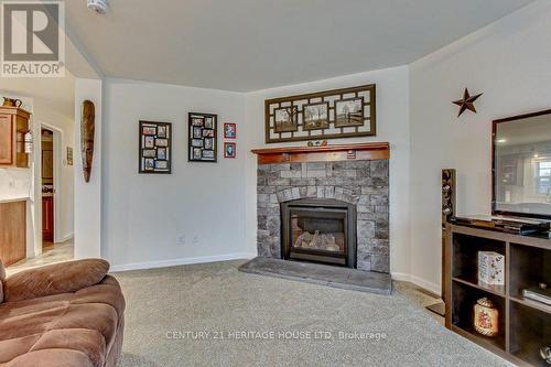 A17 - 4838 Switzer Drive W, Southwest Middlesex (Appin), ON - Indoor Photo Showing Living Room With Fireplace