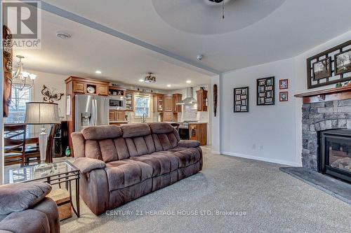 A17 - 4838 Switzer Drive W, Southwest Middlesex (Appin), ON - Indoor Photo Showing Living Room With Fireplace