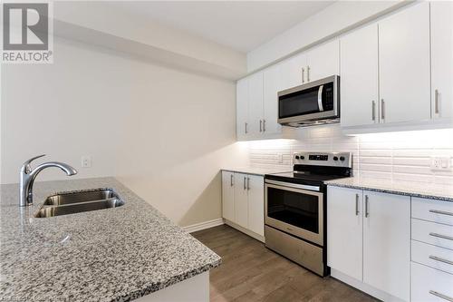 Kitchen w/ Stainless Steel Appliances - 150 Oak Park Boulevard Unit# 320, Oakville, ON - Indoor Photo Showing Kitchen With Stainless Steel Kitchen With Double Sink With Upgraded Kitchen