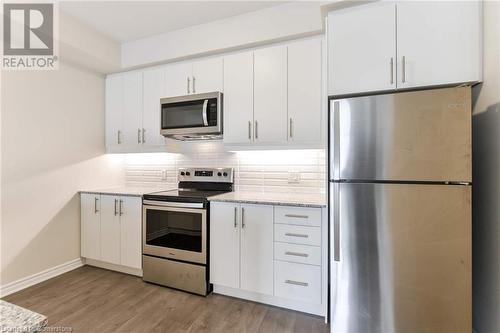 Kitchen w/ Stainless Steel Appliances - 150 Oak Park Boulevard Unit# 320, Oakville, ON - Indoor Photo Showing Kitchen With Stainless Steel Kitchen