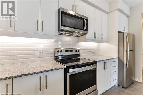 Kitchen w/ Stainless Steel Appliances - 150 Oak Park Boulevard Unit# 320, Oakville, ON - Indoor Photo Showing Kitchen With Stainless Steel Kitchen With Upgraded Kitchen