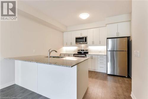 Kitchen - 150 Oak Park Boulevard Unit# 320, Oakville, ON - Indoor Photo Showing Kitchen With Stainless Steel Kitchen With Double Sink With Upgraded Kitchen