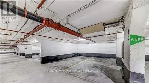 303 - 40 Panorama Court, Toronto (Mount Olive-Silverstone-Jamestown), ON - Indoor Photo Showing Garage