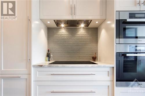 Cook top alcove with double oven beside. - 20 The Driveway Drive Unit#1801, Ottawa, ON - Indoor Photo Showing Kitchen