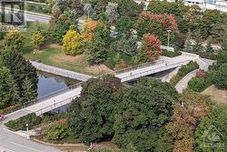 View of canal below and bridge to the University of Ottawa. - 