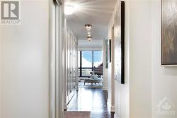 Hallway to entertainment size living room. - 