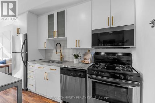 424 - 1 Shaw Street, Toronto, ON - Indoor Photo Showing Kitchen With Stainless Steel Kitchen With Double Sink With Upgraded Kitchen