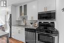 424 - 1 Shaw Street, Toronto, ON  - Indoor Photo Showing Kitchen With Stainless Steel Kitchen With Double Sink With Upgraded Kitchen 