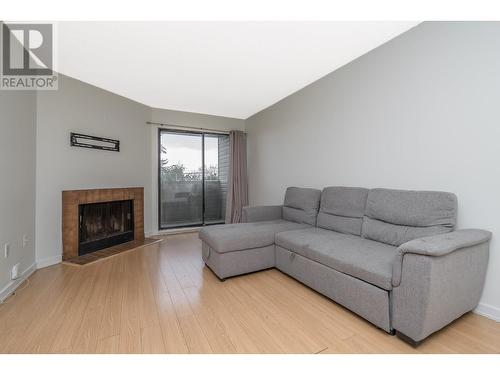 311 615 North Road, Coquitlam, BC - Indoor Photo Showing Living Room With Fireplace