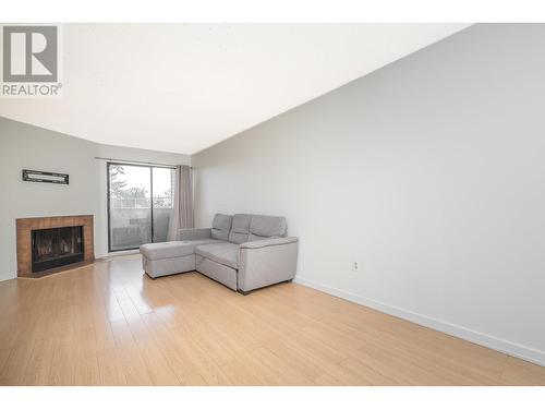 311 615 North Road, Coquitlam, BC - Indoor Photo Showing Living Room With Fireplace