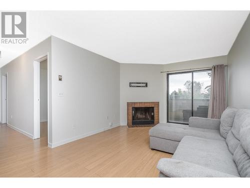 311 615 North Road, Coquitlam, BC - Indoor Photo Showing Living Room With Fireplace