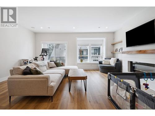 117 3409 Harper Road, Coquitlam, BC - Indoor Photo Showing Living Room With Fireplace