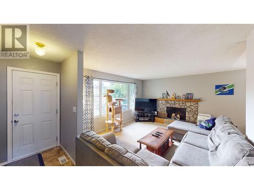 1385 Lewis Drive, Quesnel, BC - Indoor Photo Showing Living Room With Fireplace