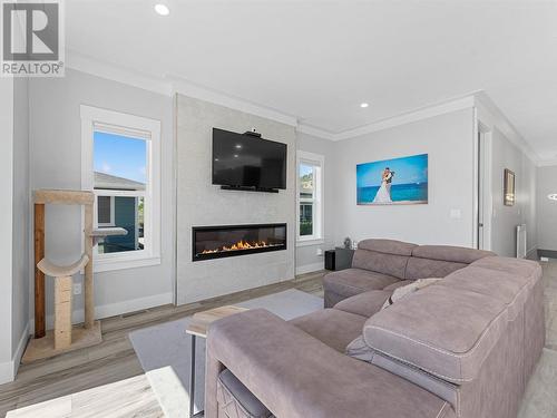 229 Tupman Crescent, Kelowna, BC - Indoor Photo Showing Living Room With Fireplace