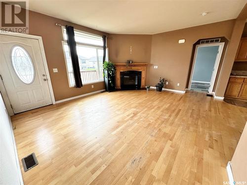 796 Johnston Drive, Weyburn, SK - Indoor Photo Showing Living Room With Fireplace