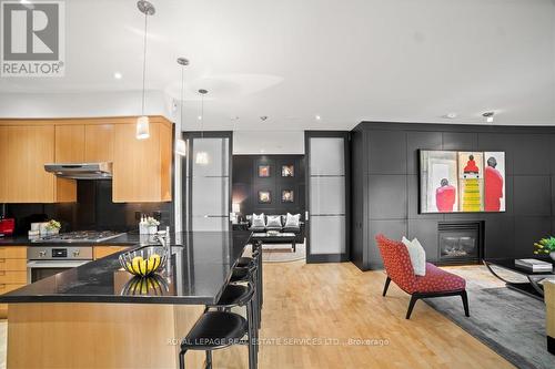 104 - 20 Scrivener Square, Toronto (Rosedale-Moore Park), ON - Indoor Photo Showing Kitchen With Fireplace With Upgraded Kitchen