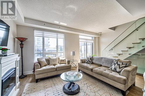 12 - 1245 Bayly Street, Pickering, ON - Indoor Photo Showing Living Room With Fireplace