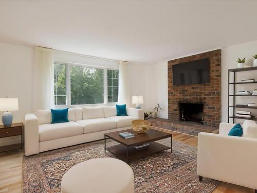 Living room - 121 Av. De Forest Gardens, Pointe-Claire, QC - Indoor Photo Showing Living Room With Fireplace