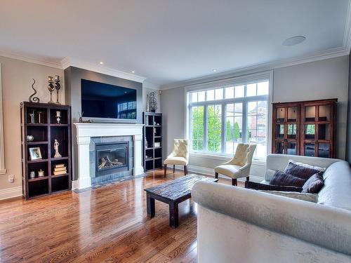 Living room - 412 Rue Des Alismas, Laval (Sainte-Dorothée), QC - Indoor Photo Showing Living Room With Fireplace