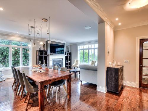 Dining room - 412 Rue Des Alismas, Laval (Sainte-Dorothée), QC - Indoor Photo Showing Dining Room With Fireplace