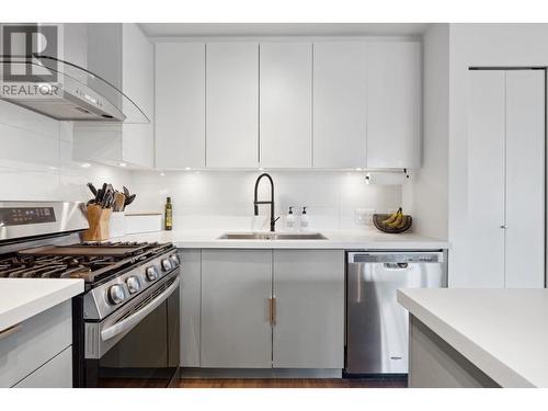 102 3602 Aldercrest Drive, North Vancouver, BC - Indoor Photo Showing Kitchen With Double Sink With Upgraded Kitchen