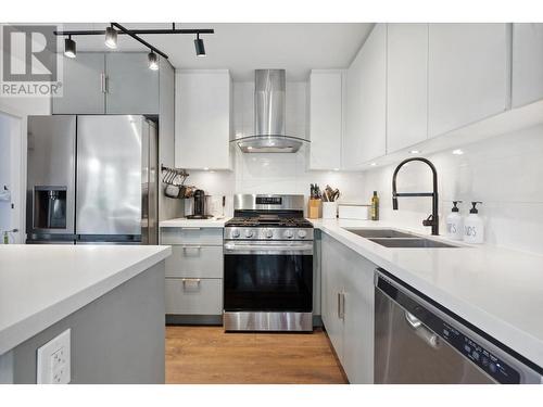 102 3602 Aldercrest Drive, North Vancouver, BC - Indoor Photo Showing Kitchen With Double Sink With Upgraded Kitchen