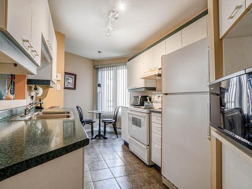 Cuisine - 8-139 Rue Sévigny, Repentigny (Repentigny), QC - Indoor Photo Showing Kitchen With Double Sink