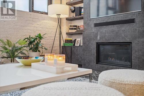 8 - 50 Bartlett Avenue, Toronto, ON - Indoor Photo Showing Living Room With Fireplace