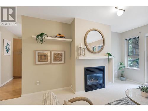 307 9319 University Crescent, Burnaby, BC - Indoor Photo Showing Living Room With Fireplace