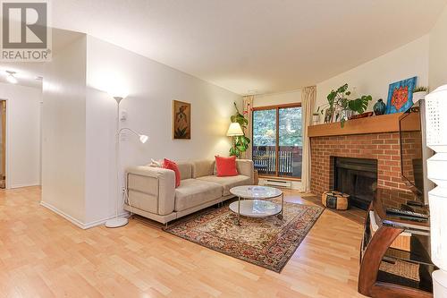 234 7651 Minoru Boulevard, Richmond, BC - Indoor Photo Showing Living Room With Fireplace