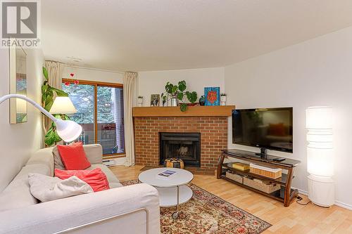 234 7651 Minoru Boulevard, Richmond, BC - Indoor Photo Showing Living Room With Fireplace