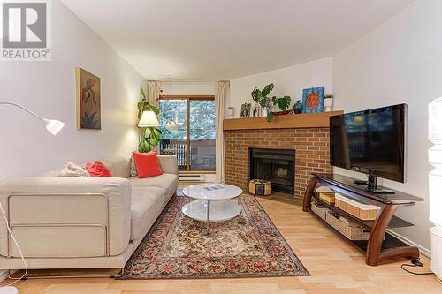 234 7651 Minoru Boulevard, Richmond, BC - Indoor Photo Showing Living Room With Fireplace