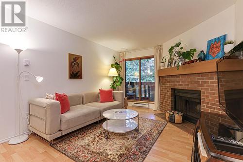 234 7651 Minoru Boulevard, Richmond, BC - Indoor Photo Showing Living Room With Fireplace