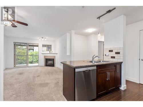 302 2468 Atkins Avenue, Port Coquitlam, BC - Indoor Photo Showing Kitchen With Fireplace With Double Sink