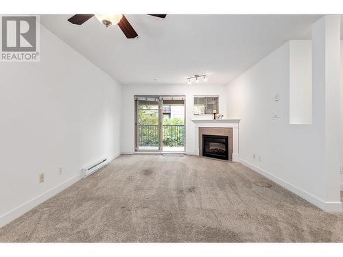 302 2468 Atkins Avenue, Port Coquitlam, BC - Indoor Photo Showing Living Room With Fireplace