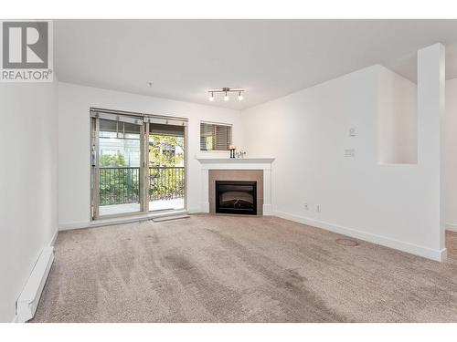 302 2468 Atkins Avenue, Port Coquitlam, BC - Indoor Photo Showing Living Room With Fireplace