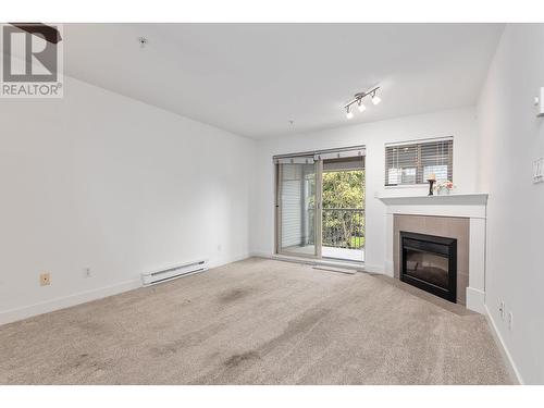 302 2468 Atkins Avenue, Port Coquitlam, BC - Indoor Photo Showing Other Room With Fireplace