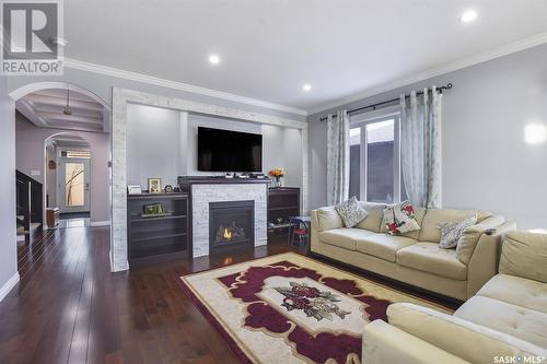 116 Emerald Ridge E, White City, SK - Indoor Photo Showing Living Room With Fireplace