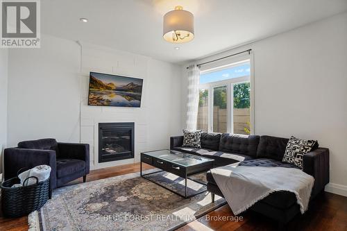 1516 North Wenige Drive, London, ON - Indoor Photo Showing Living Room With Fireplace