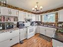 408 8Th Avenue W, Biggar, SK  - Indoor Photo Showing Kitchen With Double Sink 