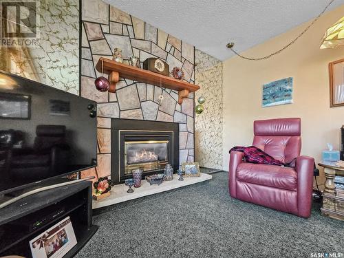 408 8Th Avenue W, Biggar, SK - Indoor Photo Showing Living Room With Fireplace