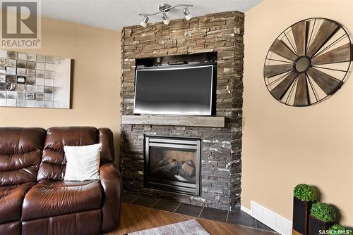 2778 Schweitzer Drive, Regina, SK - Indoor Photo Showing Living Room With Fireplace