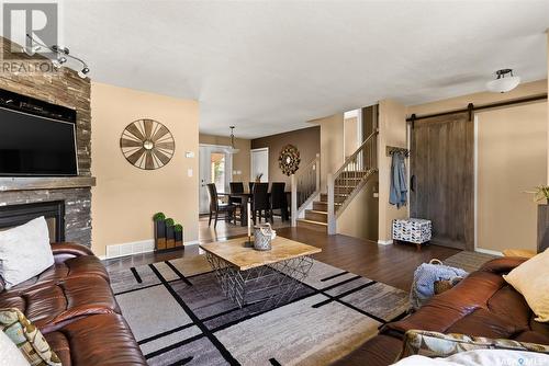 2778 Schweitzer Drive, Regina, SK - Indoor Photo Showing Living Room With Fireplace