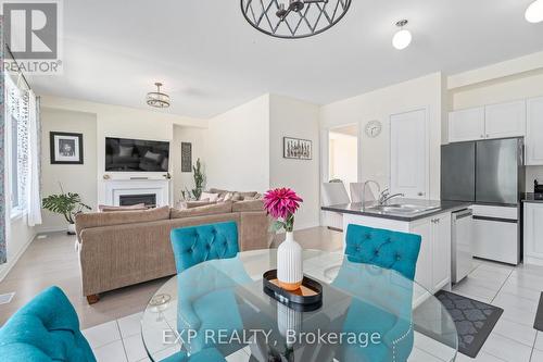 460 Black Cherry Crescent, Shelburne, ON - Indoor Photo Showing Kitchen With Fireplace