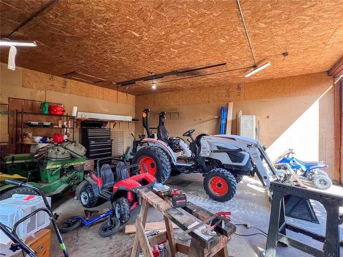 60064 87 Road W, North Cypress Rm, MB - Indoor Photo Showing Garage